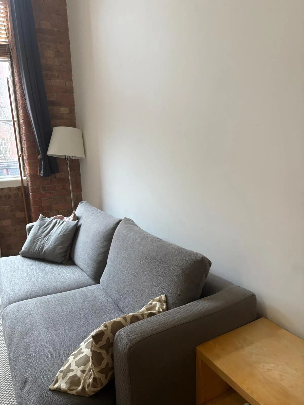 Living room sofa and lamp after a regular domestic clean